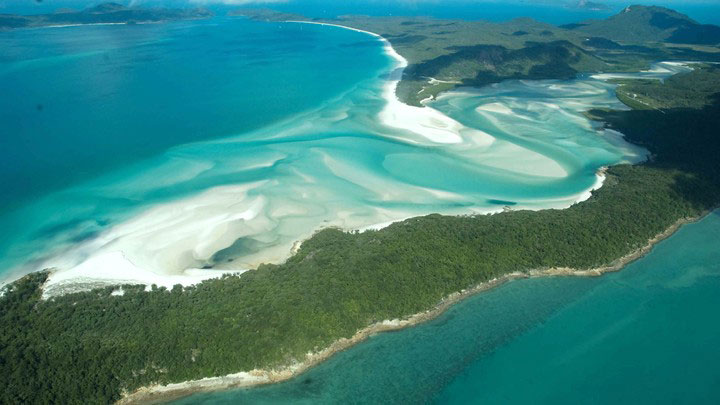 Aerial view of swirling white sandbanks in turquoise waters of Hill Inlet on Whitsunday Island
